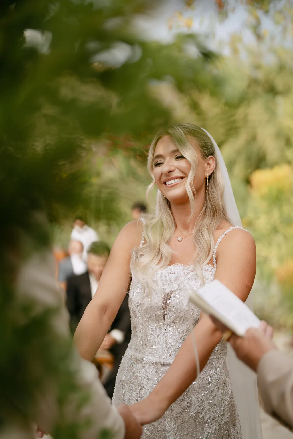 Bailey laughing while she reads her vows