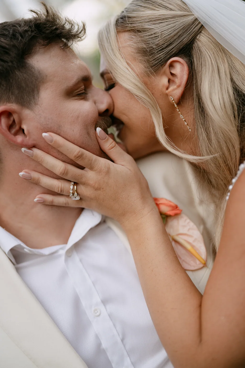 Bailey and Matthew kissing, her hand on his face