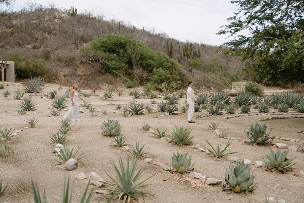 Bailey and Matthew crossing the agave field at Acre before the first look