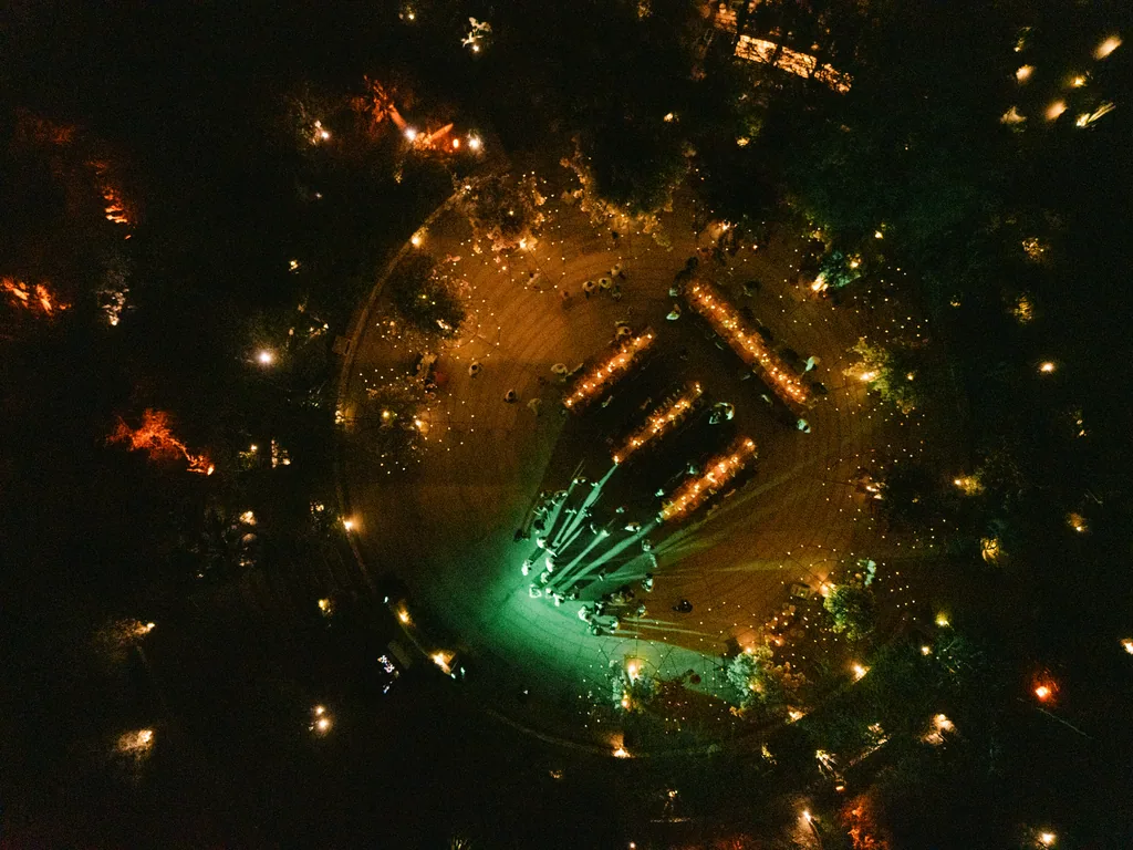 The party at night from above: the dance floor, the lights and the green beam