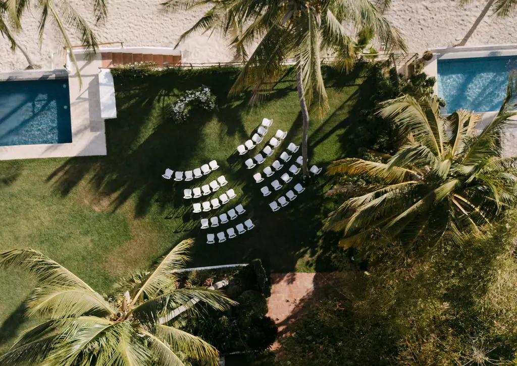 The ceremony seen from above, through the palms